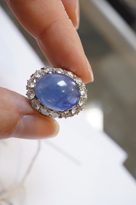 A sapphire and diamond ring, mid 20th century